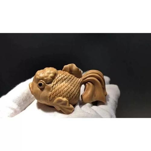 木雕金魚圖片大全大圖：“木雕金魚”傳統(tǒng)手工藝品的藝術(shù)魅力與視覺(jué)呈現(xiàn)