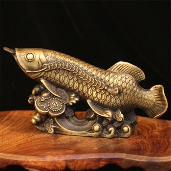 金龍魚擺件的寓意和象征，寓意著財富、吉祥和富足的象征：金龍魚擺件寓意著財富、吉祥和富足