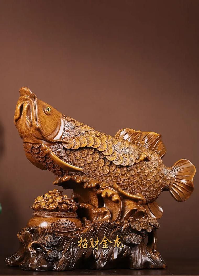 有沒有適合手機壁紙的金龍魚雕刻圖片？