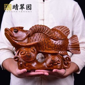 雕刻金龍魚的寓意和象征是什么：金龍魚的寓意和象征是什么