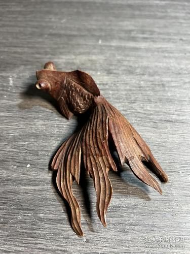 給我一些木雕金魚的圖片，木雕金魚的藝術(shù)魅力