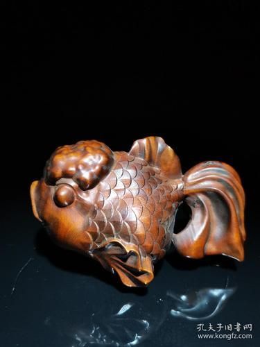 給我一些木雕金魚的圖片，木雕金魚的藝術(shù)魅力