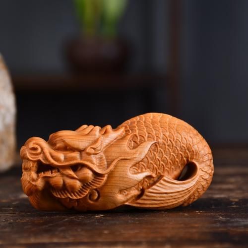 給我一些龍頭魚身擺件的圖片，龍頭魚身擺件怎么選