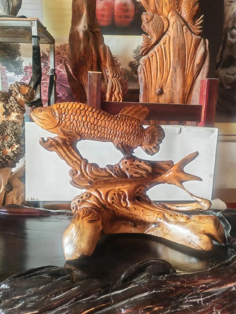 給我幾張金龍魚木雕的真品圖片，如何鑒別金龍魚木雕的真偽