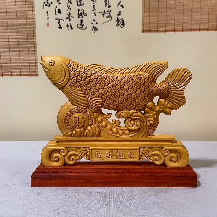 如何鑒別金龍魚木雕擺件的真?zhèn)危?，鑒別金龍魚木雕擺件的方法