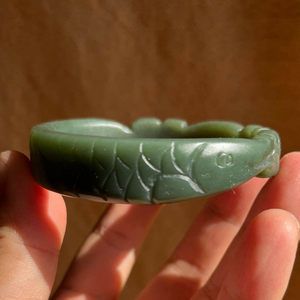 玉金龍魚擺放位置圖：玉雕金龍魚手鐲價(jià)值